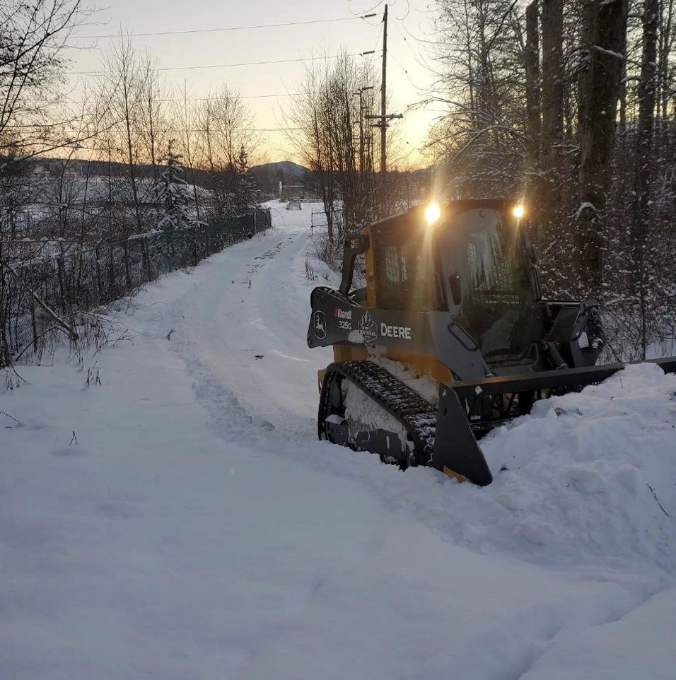 snow clearing machine clearing a road